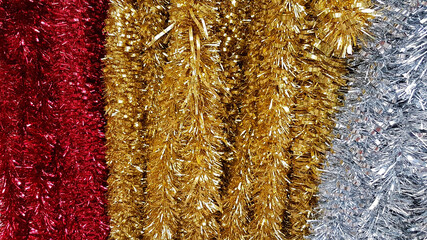 Brightly coloured shiny tinsel  ready for Christmas.