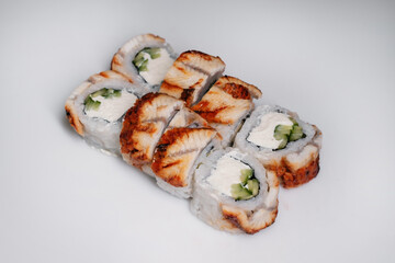 Sushi set with salmon, tuna and cream cheese close-up. Traditional Japanese cuisine side view.