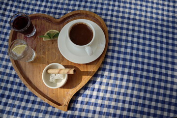 beautiful served breakfast with turkish coffee on heart wooden tray