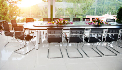 Conference table and chairs in meeting room.