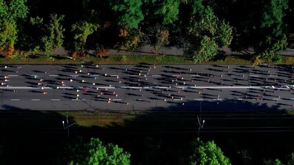 Marathon running on street. 4K Aerial drone fooage. Top view
