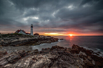 Dramatic sunrise over Portland Head Light in Maine 