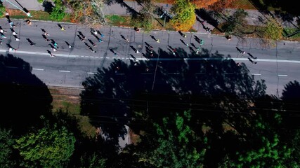Marathon running on street. 4K Aerial drone fooage. Top view