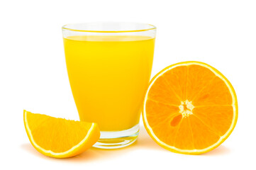 A glass of orange juice next to an orange half and a wedge