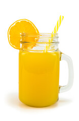 A jar of orange juice with a straw and an orange slice at the top