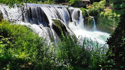 A beautiful sunny day at the Una River waterfall in Bosnia and Herzegovina.