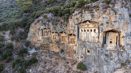 Fototapeta premium Rock-cut temple tombs in Kaunos Dalyan - Turkey (Turkish name; kaya mezarlari) Ancient city of Kaunos, Dalyan valley, Turkey. Kaunos (Latin: Caunus) was a city of ancient Caria and in Anatolia
