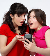 Happy friends  hugging each other.Teenage girl using smart phone.Selfie.Girl have fun .