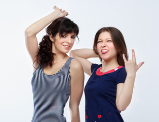 Happy friends  hugging each other.Teenage girl using smart phone.Selfie.Girl have fun .