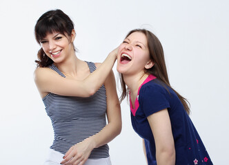 Happy friends  hugging each other.Teenage girl using smart phone.Selfie.Girl have fun .