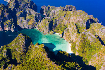 View from above, stunning aerial view of Maya Bay with its turquoise water and a white sand beach. Ko Phi Phi Leh is an island of the Phi Phi Archipelago, Krabi Province, Thailand