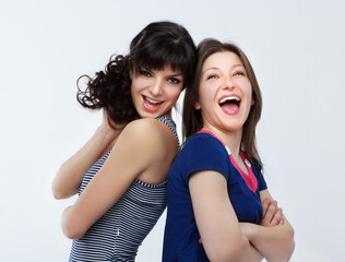 Happy friends  hugging each other.Teenage girl using smart phone.Selfie.Girl have fun .