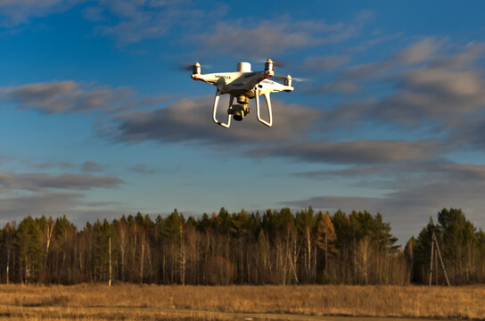 Professional quadcopter with high resolution camera onboard doing its job