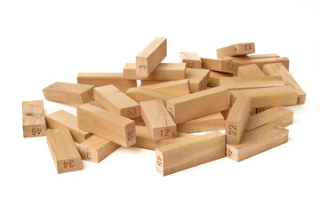 Numbered wooden blocks of the Jenga Tower board game on a white background. Home entertainment