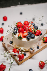 Beautiful strawberry cake decorated with strawberries and blueberries