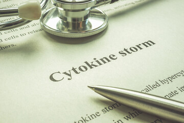 Page about cytokine storm, stethoscope and pen.