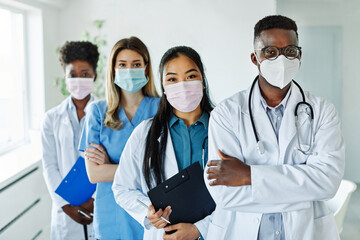 doctor woman portrait hospital team man nurse medical health medicine diversity unity multiracial black asian healthcare mask virus protection clinic teamwork group