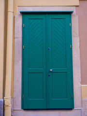 Green wooden door. Colorful Entry Doors of the houses in Lviv, Ukraine