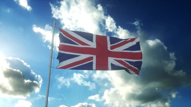 Flag of United Kingdom waving at wind against beautiful blue sky