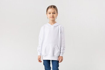 Cute little girl in white blank sweatshirt.
