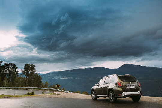 Utvik, Sogn Og Fjordane County, Norway. Car Renault Duster Suv Parked Near Scenic Route Road. Innvikfjord Norwegian Mountain Landscape. Natural Landmark And Popular Destination.