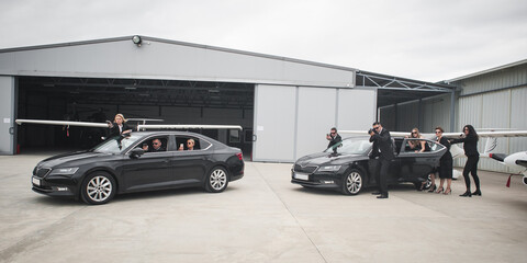 Security team of bodyguards protect celebrity vip in car limousine - obrazy, fototapety, plakaty