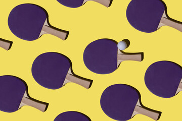 Bright pattern, top view, background with table tennis rackets and ball. Game, recreation, sports