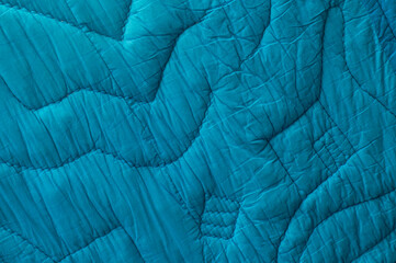 blue large bedspread. turquoise unusual texture. sapphirine rippled background. light embossed surface