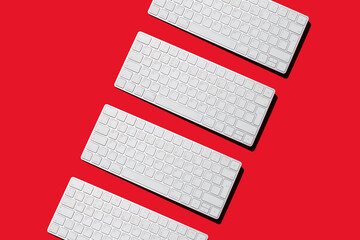 wireless keyboard from computer on red background