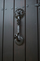 New decorative metal door knocker on wood door close