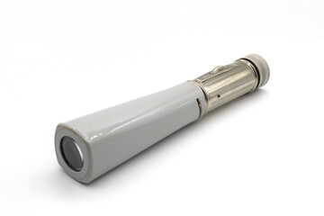 Vintage grey flashlight, isolated on a white background