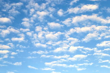 White stratus clouds on summer blue sky - simple blurred background