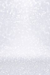 Silver white glitter snow background for Christmas or anniversary bokeh