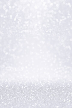 Silver white glitter snow background for Christmas or anniversary bokeh