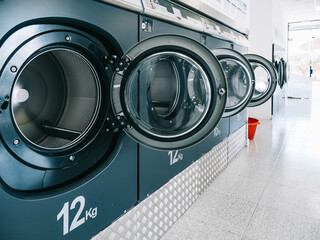 industrial washing machines in a public laundromat