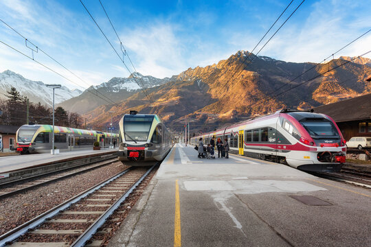 Transport in South Tyrol. Railway station Meran (Merano) with trains on the background of the mountains. EMU trains, railway landscape. Italy, Merano, January 31, 2020.