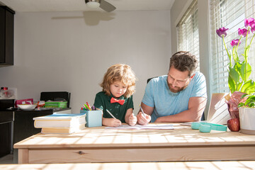family and parenthood blog. boy do homework with private teacher. drawing lesson.