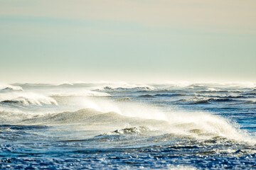 Large waves on the beach of Ebro delta in Spain on a sunny day