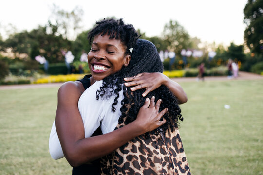 Black Women Sisterhood, Smiling Outdoors, Embracing, Hugging 