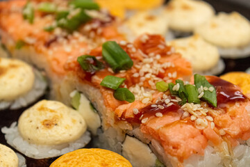 Japanese dish of sushi or rolls close-up.