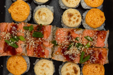 Japanese dish of sushi or rolls close-up.