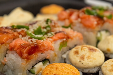 Japanese dish of sushi or rolls close-up.
