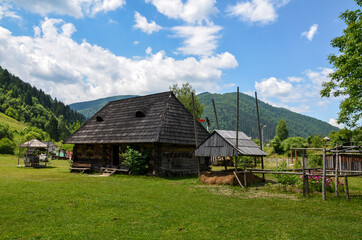 Fototapeta na wymiar Traditional Carpathian landscape picturesque architecture, wooden houses in a Kolochava mountain village in summer