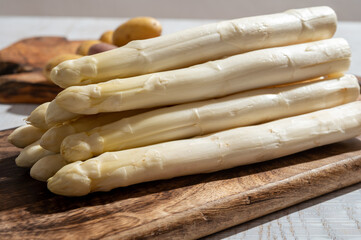 New harvest of high quality German white asparagus washed, uncooked, tasty vegetarian dinner