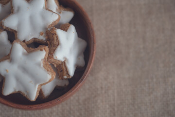 Christmas cookies in the shape of a star with white icing.