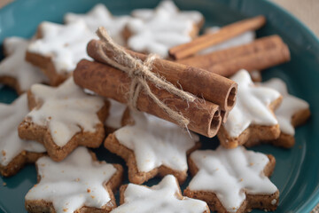 Christmas cookies in the shape of a star with white icing.