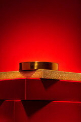 Majestic red podium of gift boxes, golden circle Red background.