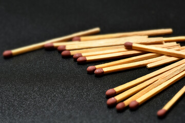 close up of matches on black background. selective focus