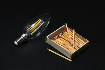 close-up on a bulb light with matches on a black background