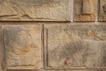 Brown stone wall background on a building
